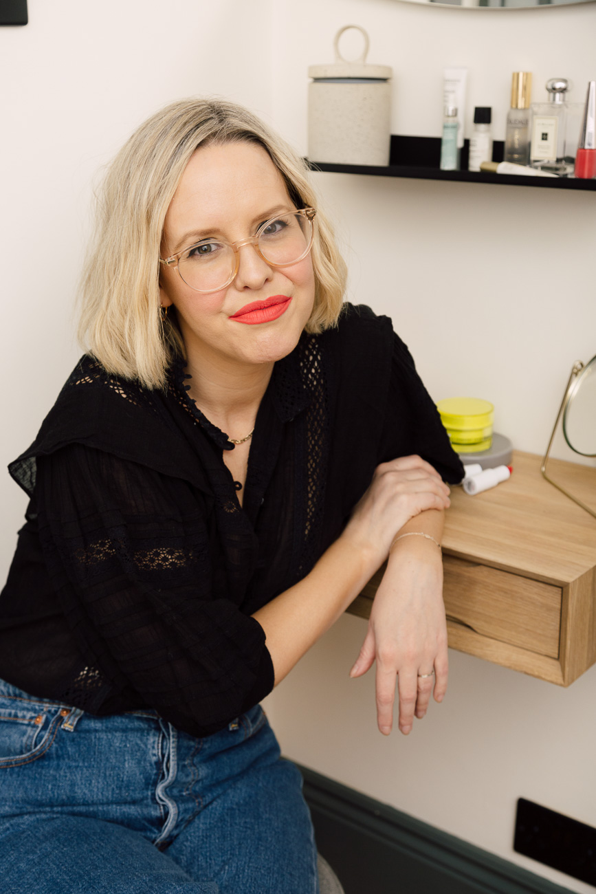 Alexandra Stedman of The Frugality sat at her dresser table wearing the 'Unattached' Stunna lip paint by Fenty Beauty.